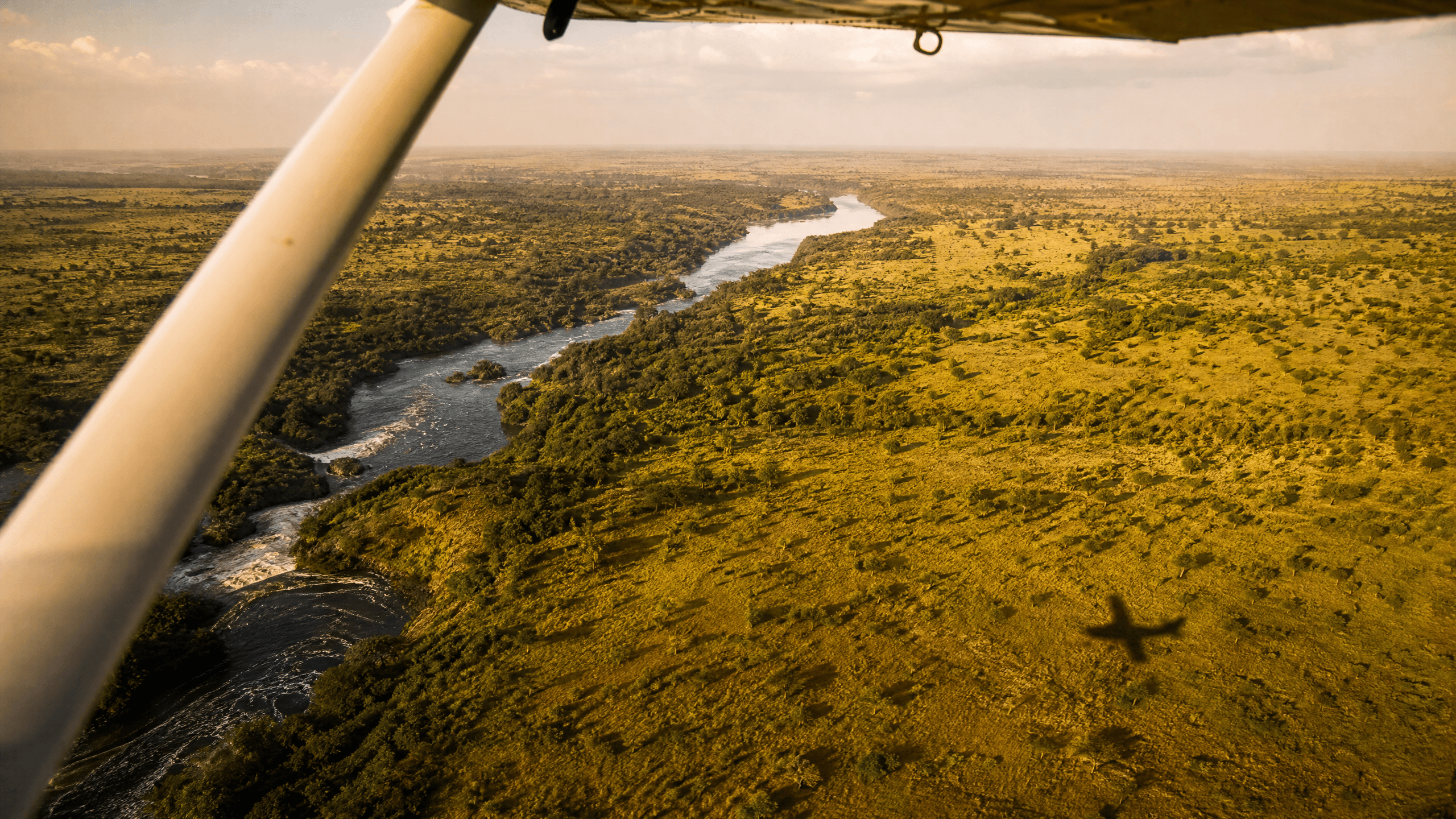 View from a charter aircraft window over the Victoria Nile and Murchison Falls National Park, Uganda