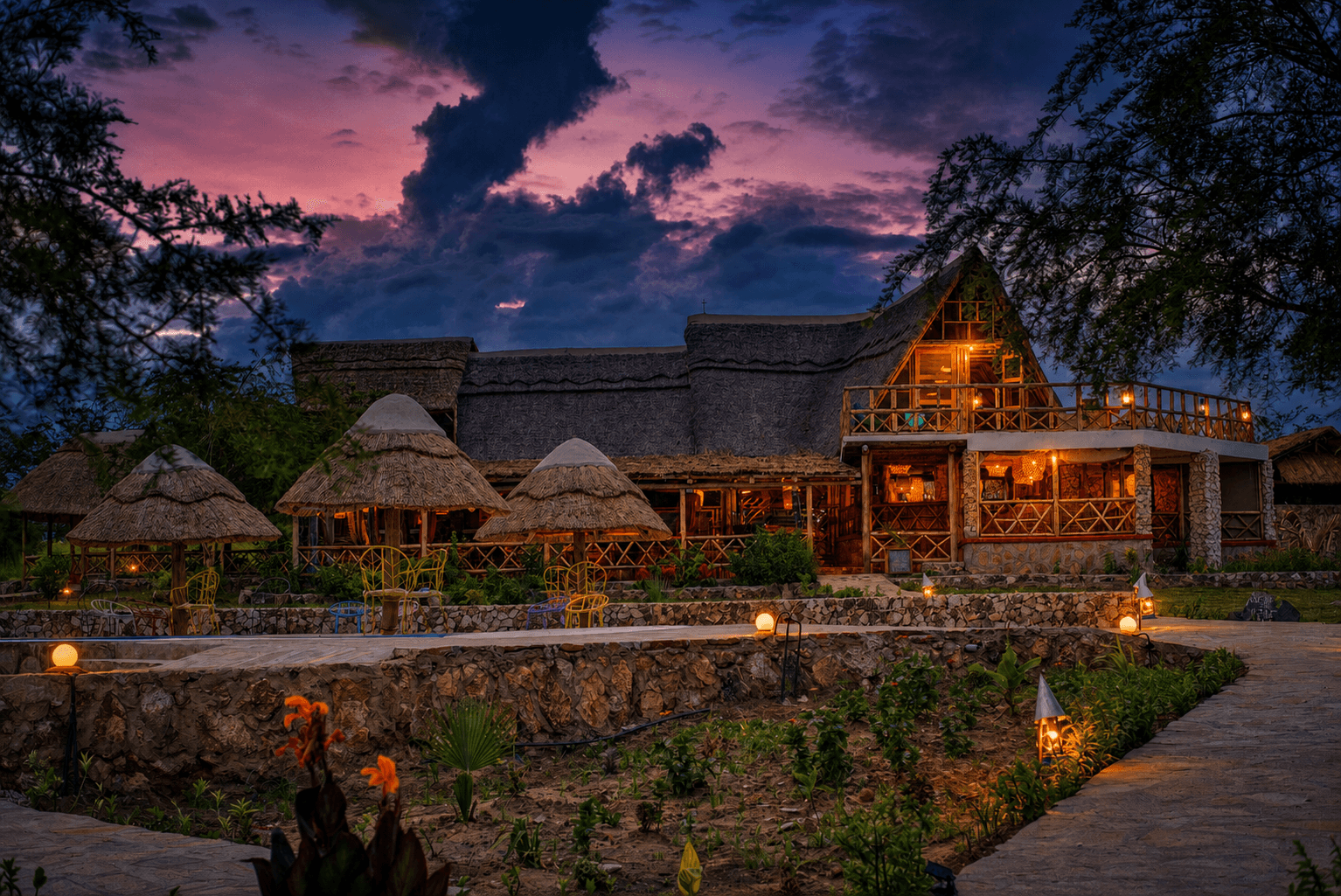 The Elephant Oasis A-frame lodge structure with terrace and savanna views, Murchison Falls Uganda